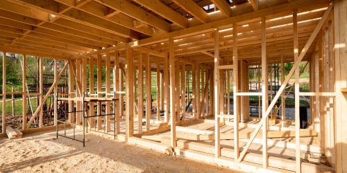 Interior frame of new wooden house under construction Interior frame of new wooden house under construction
